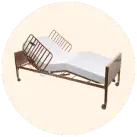 Image of a hospital bed against a cream circular background.